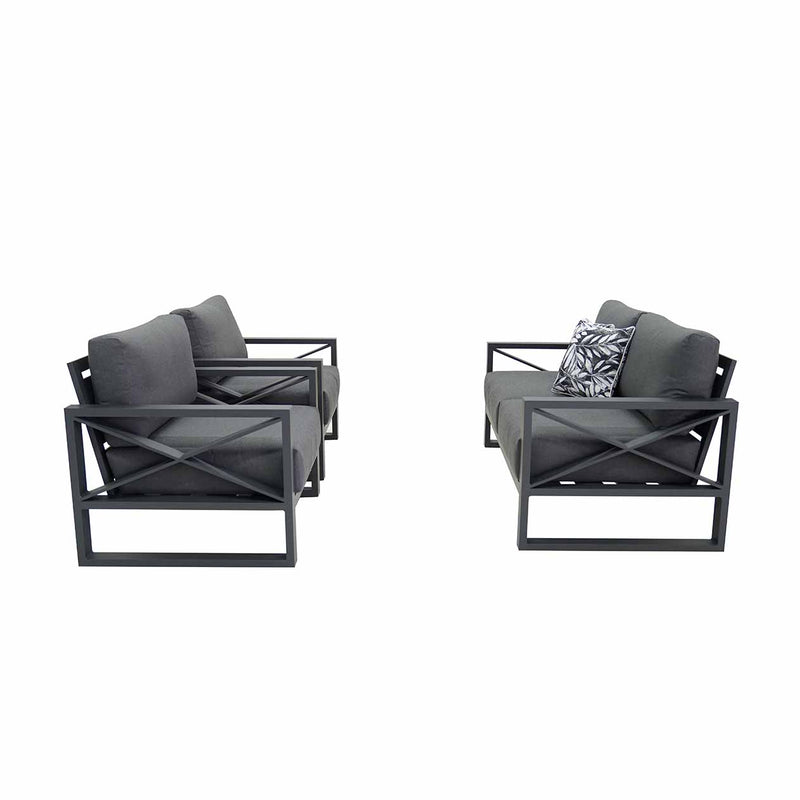 Aluminium outdoor furniture set from Linear Lounge collection, featuring a 4-seater lounge with charcoal frame and cushions, and a printed black and white cushion, perfect for outdoor lounging.